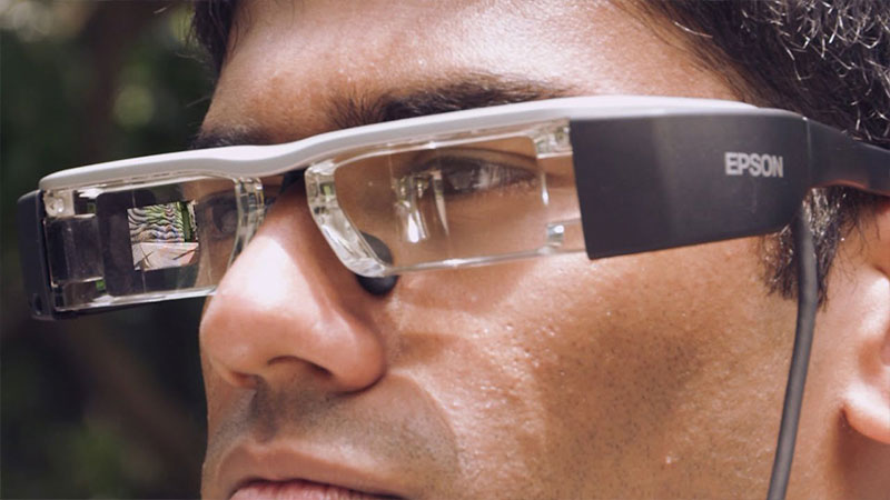 A man wearing a pair of smart glasses