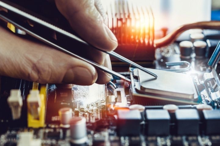 A digital device's hardware being repaired